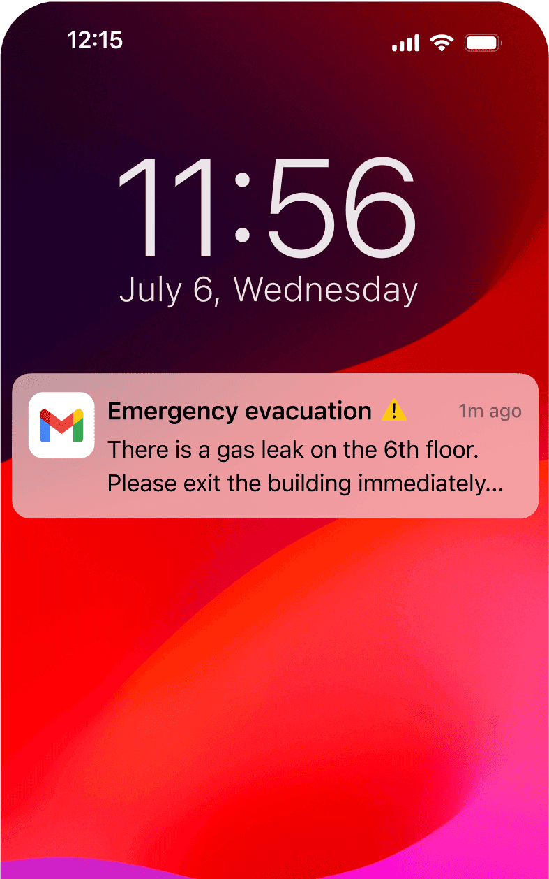 Mobile phone notification showing an emergency evacuation alert for a gas leak on the 6th floor.